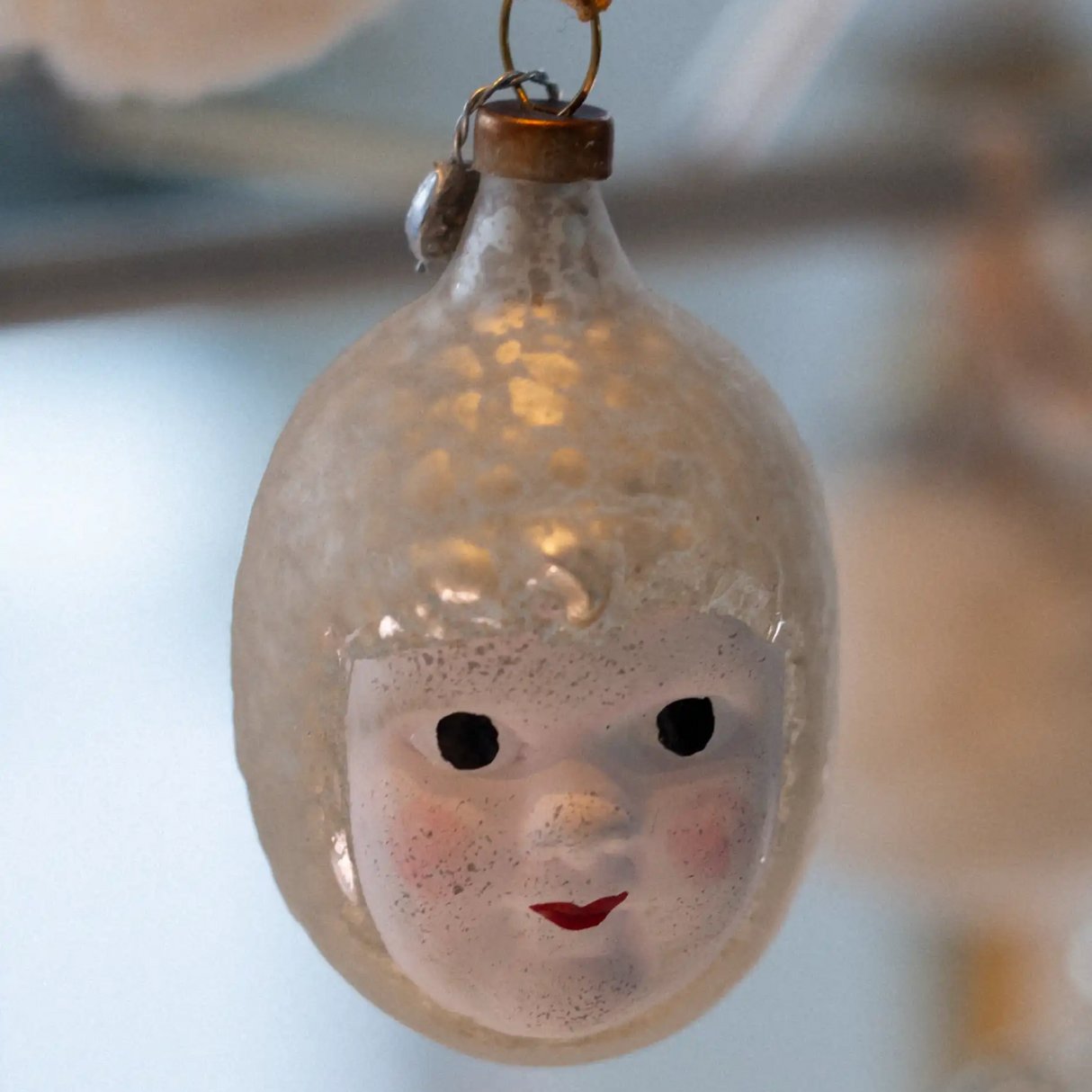 Glass baby angel head ornament